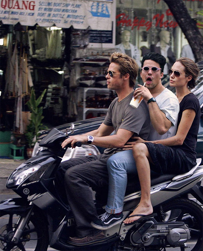 Riding a scooter with Brad Pitt and Angelina Jolie.