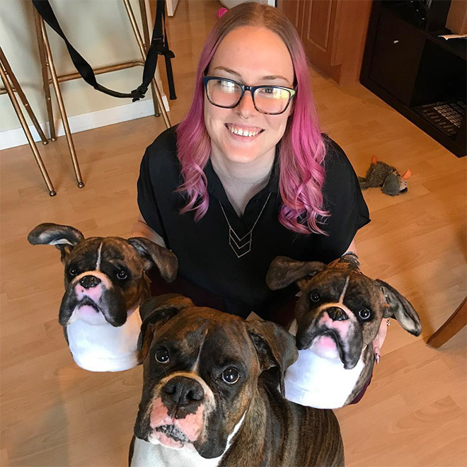 Dog posing with slippers that look just like him.