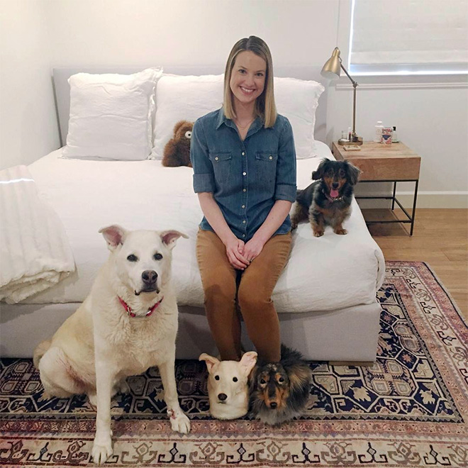 Dogs posing with slippers that look just like them.