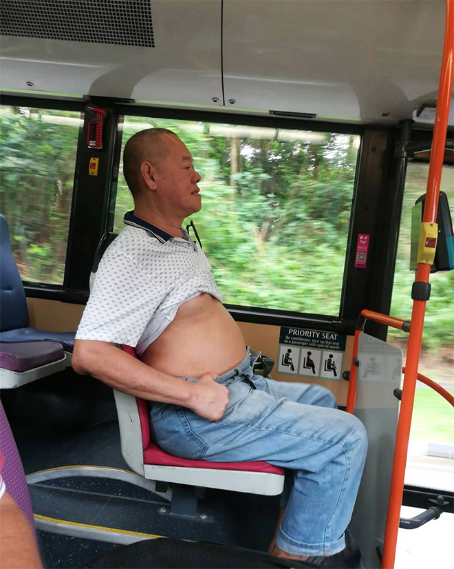 Beijing bikini fan riding a bus.