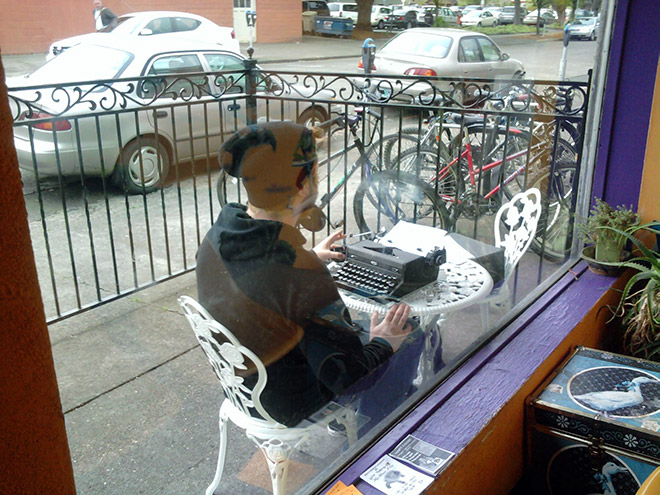 Hipster working from a cafe.