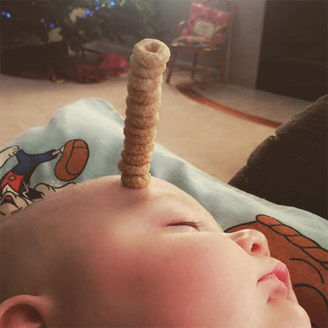 Weird viral trend: stacking Cheerio on babies.