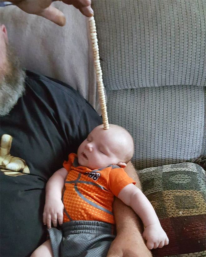 Weird viral trend: stacking Cheerio on babies.