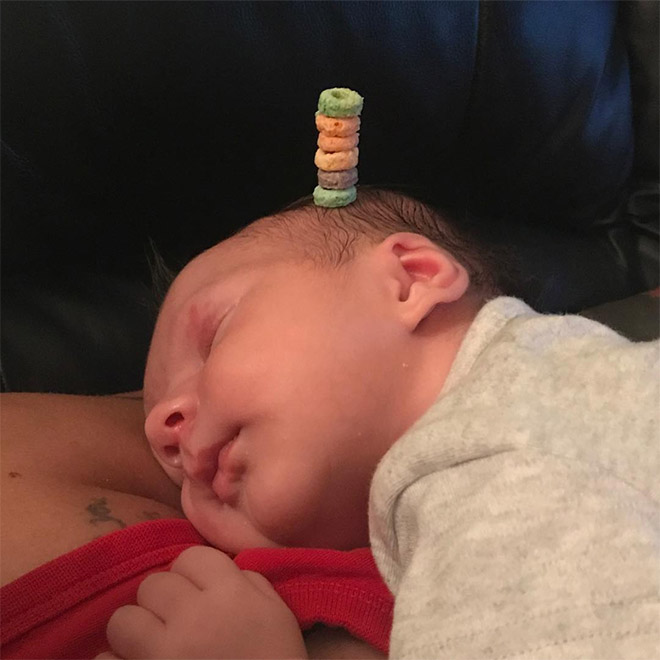 Weird viral trend: stacking Cheerio on babies.