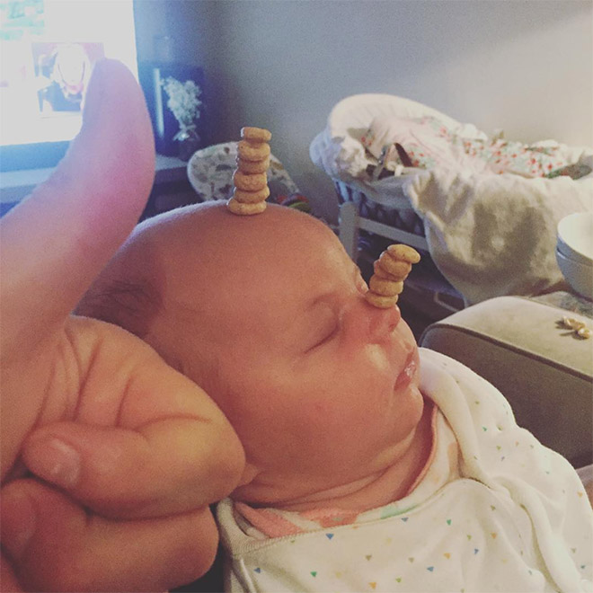 Weird viral trend: stacking Cheerio on babies.