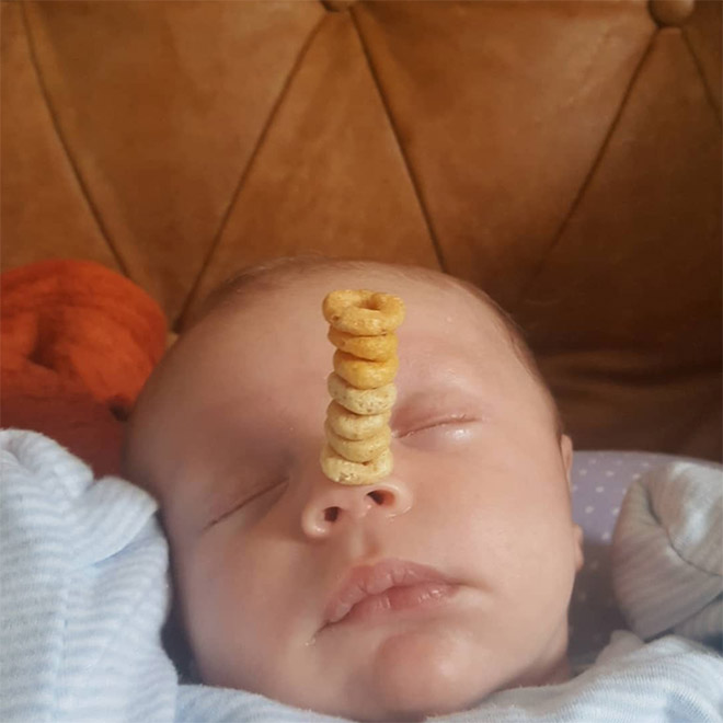 Weird viral trend: stacking Cheerio on babies.