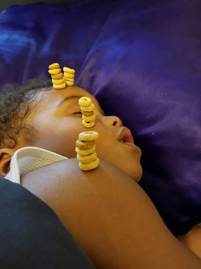 Weird viral trend: stacking Cheerio on babies.