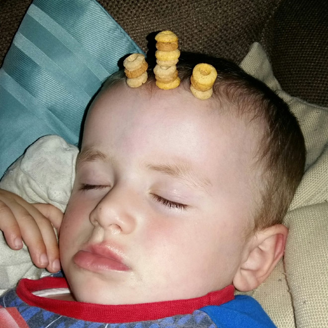 Weird viral trend: stacking Cheerio on babies.