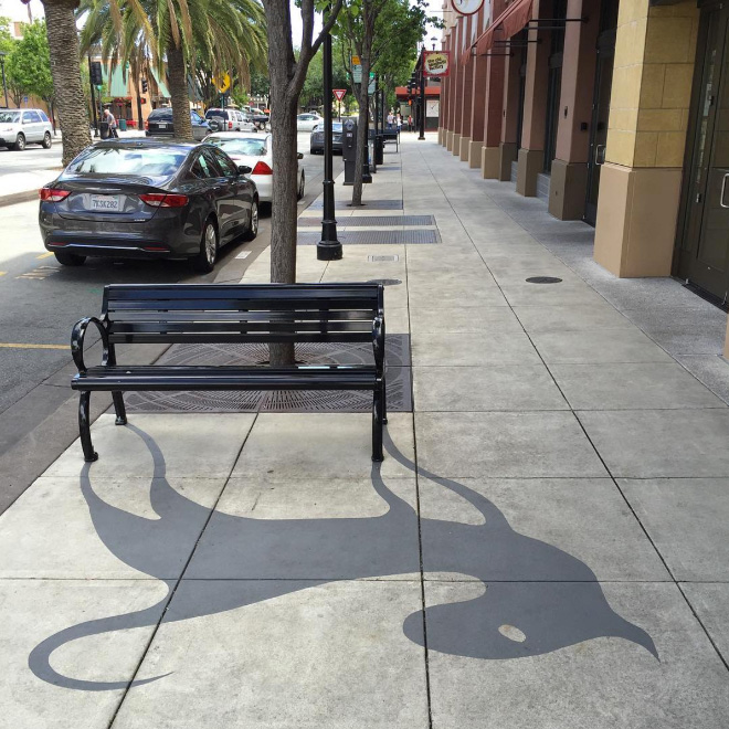 Fake shadow painted by a street artist to confuse people.