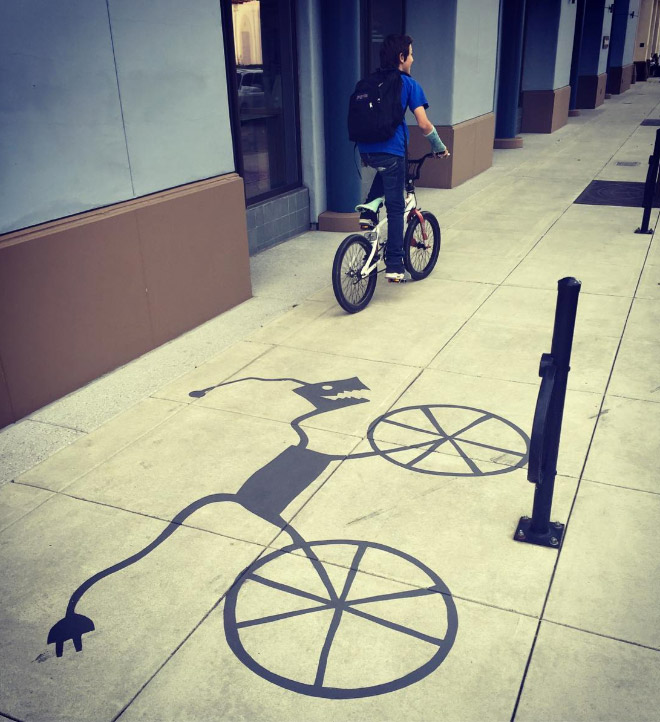 Fake shadow painted by a street artist to confuse people.