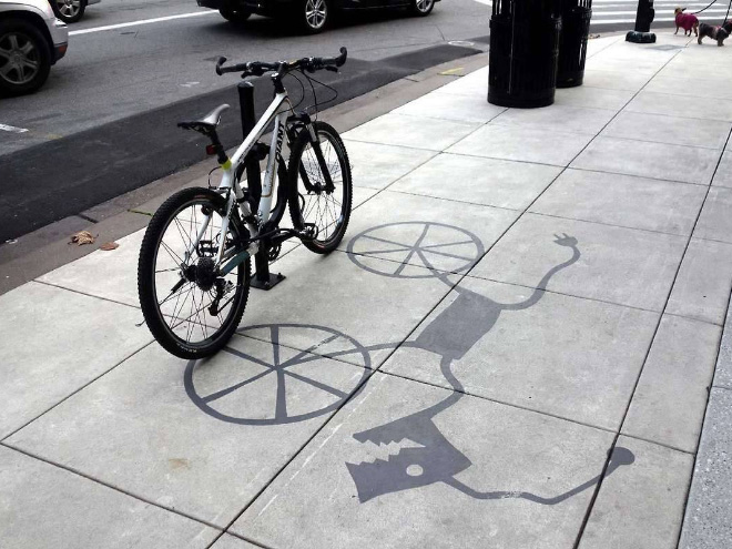 Fake shadow painted by a street artist to confuse people.