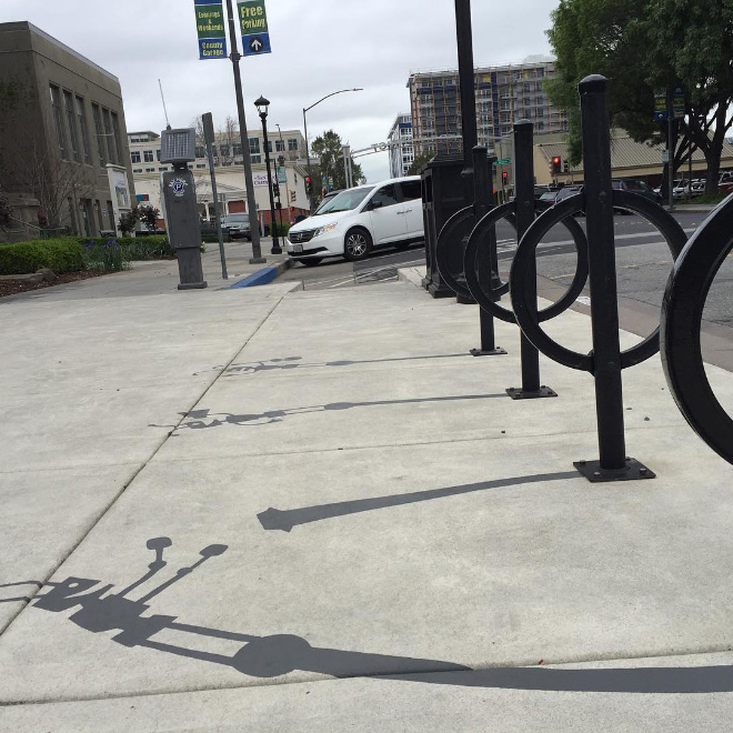 Fake shadow painted by a street artist to confuse people.