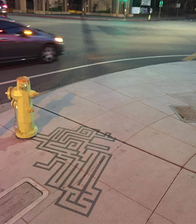 Fake shadow painted by a street artist to confuse people.