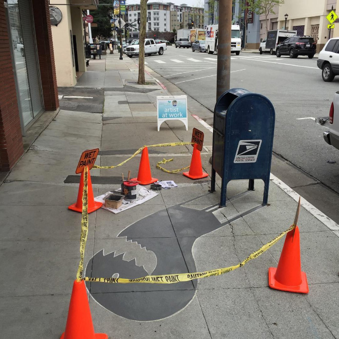 Fake shadow painted by a street artist to confuse people.