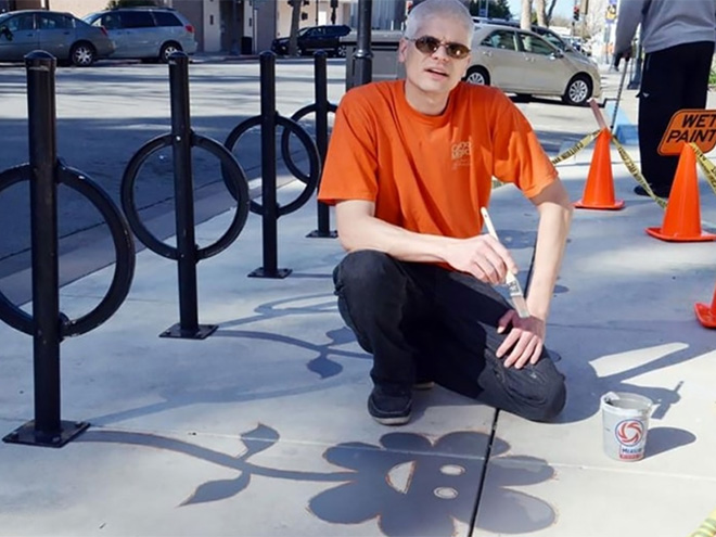 Fake shadow painted by a street artist to confuse people.
