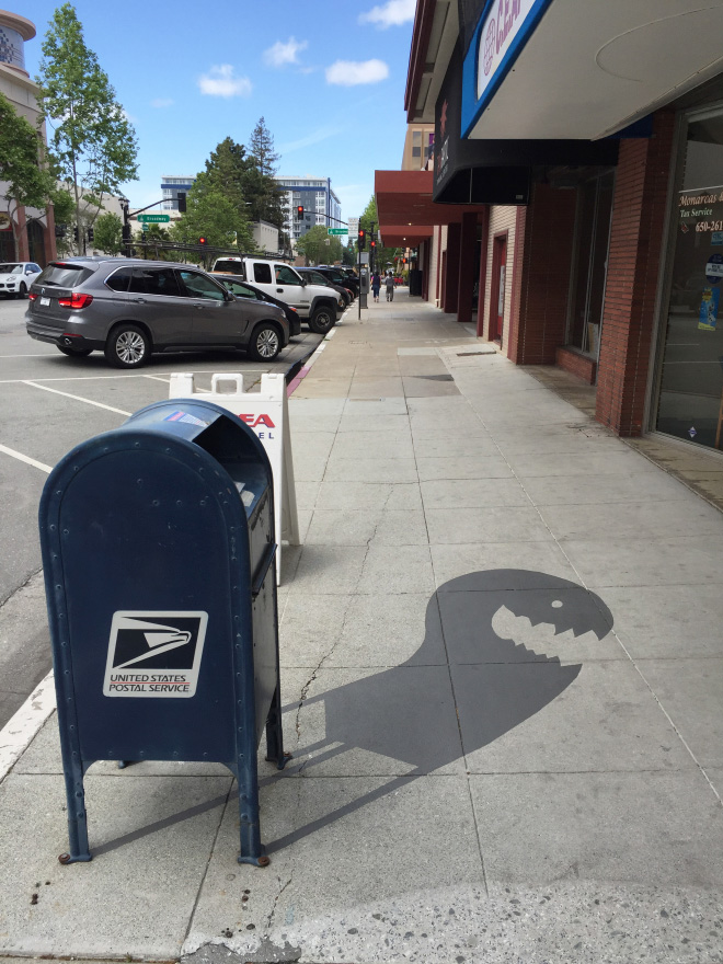 Fake shadow painted by a street artist to confuse people.