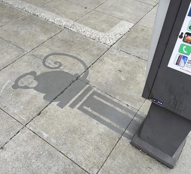 Fake shadow painted by a street artist to confuse people.