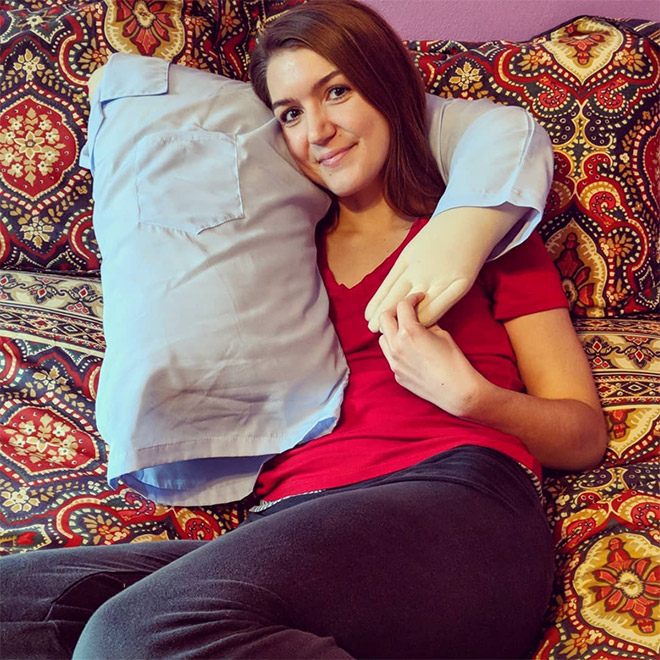 Lonely woman with a "boyfriend pillow".