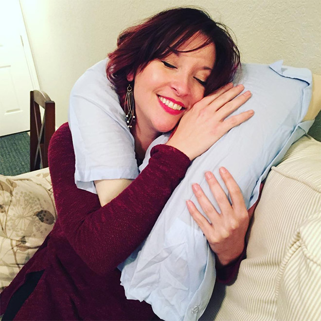 Lonely woman with a "boyfriend pillow".