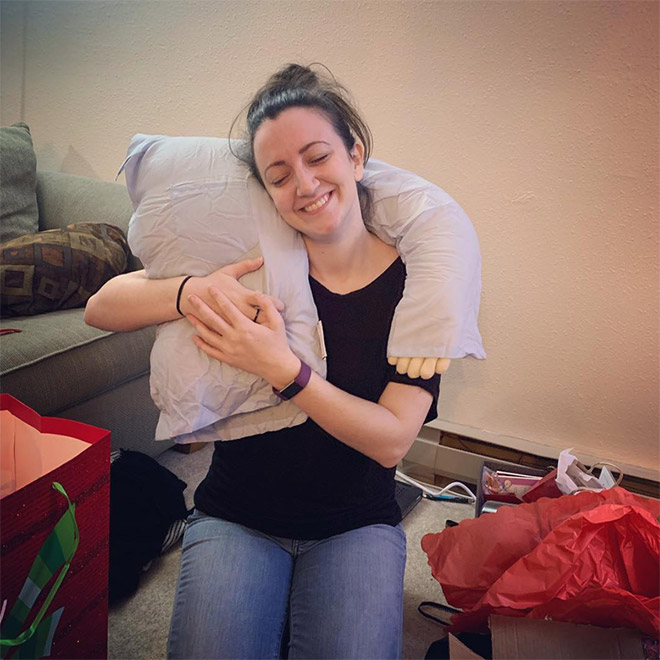 Lonely woman with a "boyfriend pillow".