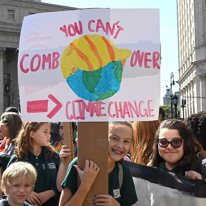 Funny climate change protest sign.