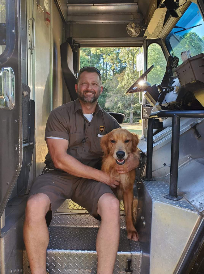 UPS drivers sometimes meet dogs along their daily route...