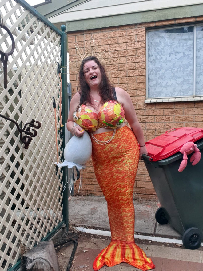 Taking out the trash in a costume.