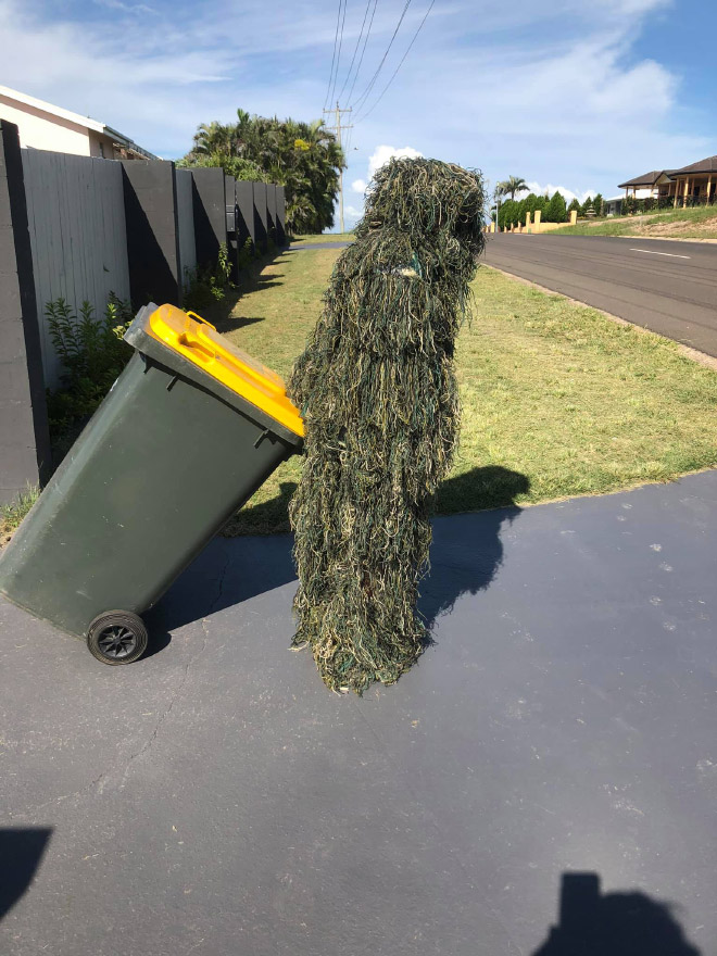 Taking out the trash in a costume.