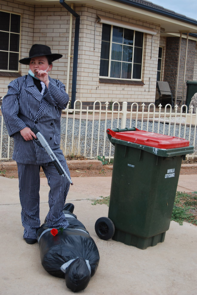 Taking out the trash in a costume.