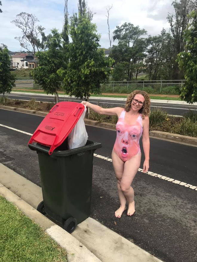 Taking out the trash in a costume.