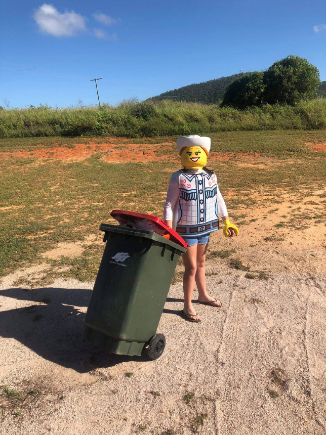 Taking out the trash in a costume.