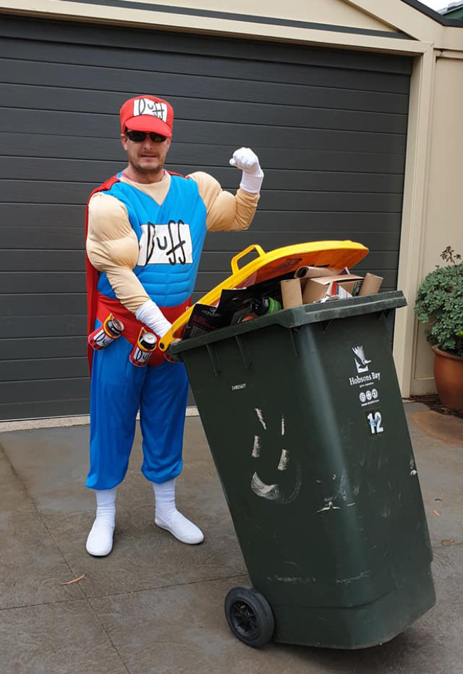 Taking out the trash in a costume.