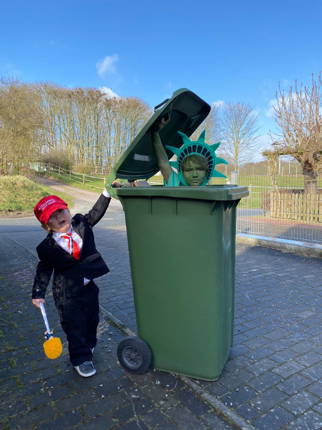 Taking out the trash in a costume.