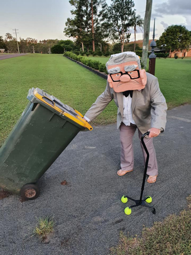 Taking out the trash in a costume.