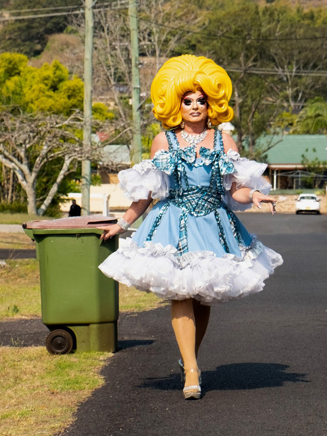 Taking out the trash in a costume.