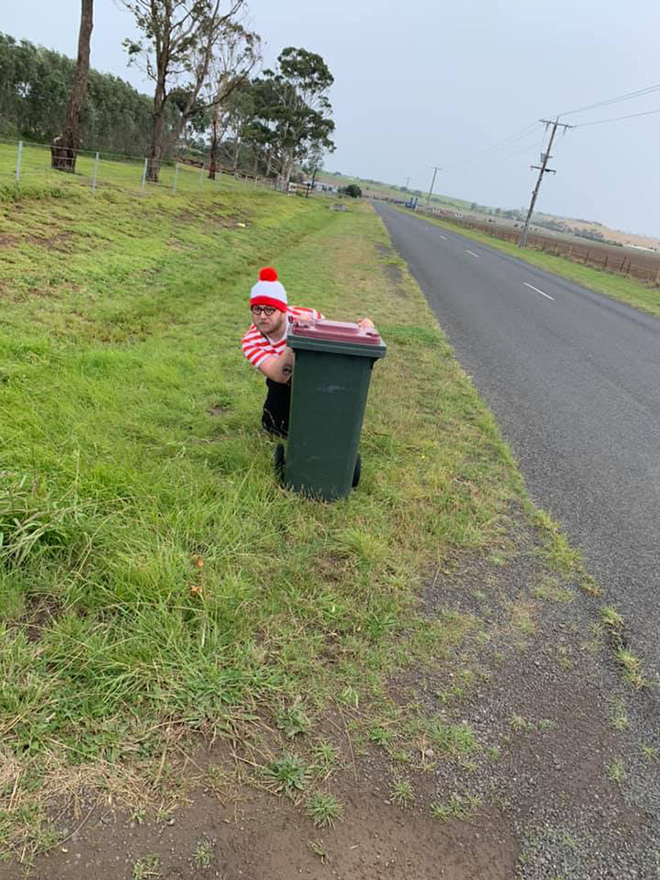 Taking out the trash in a costume.