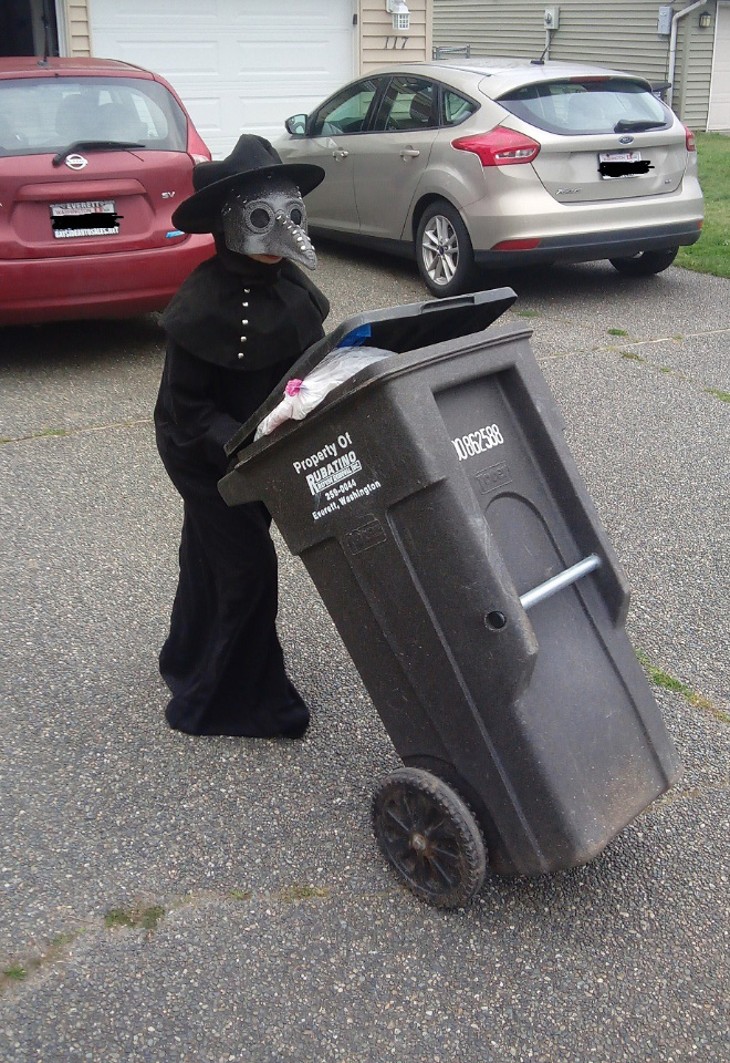 Taking out the trash in a costume.