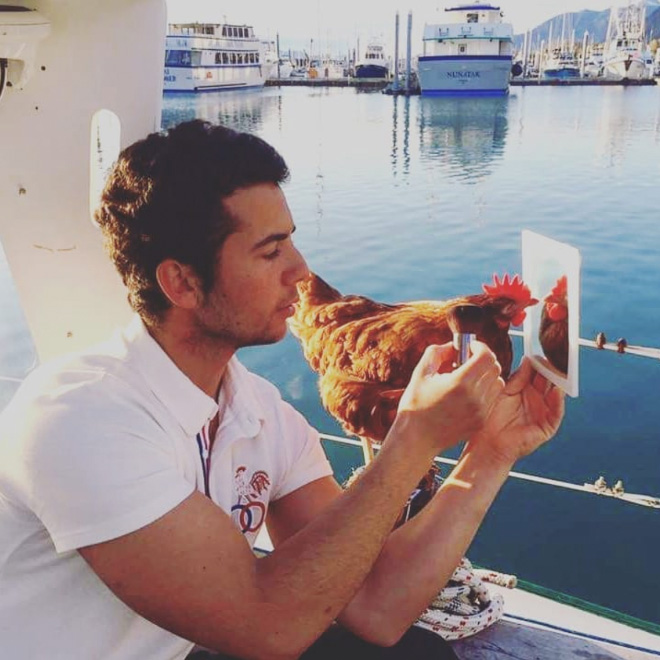 Sailing together with a pet chicken.