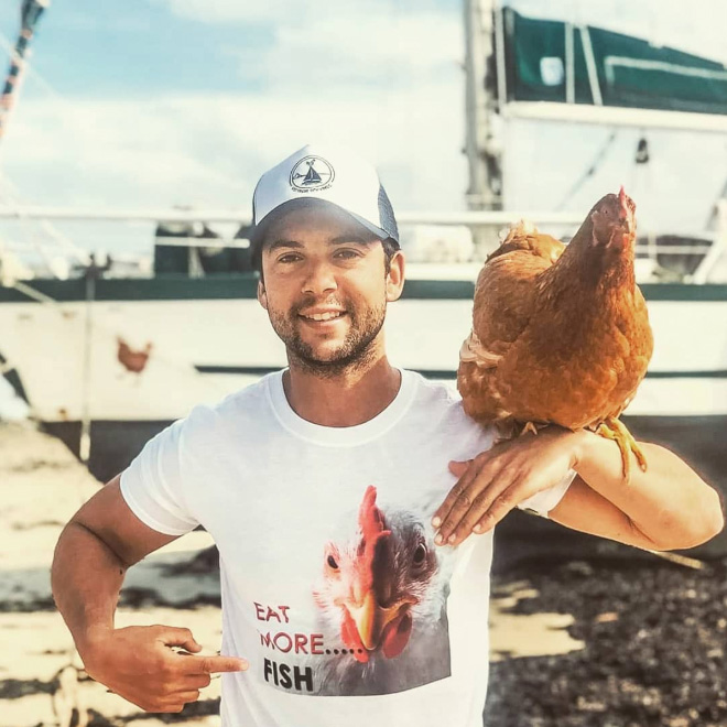 Sailing together with a pet chicken.