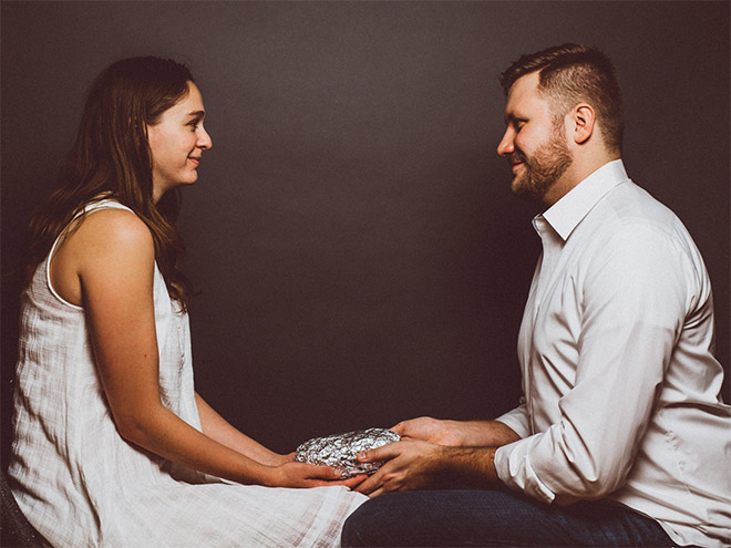 Happy young baby burrito parents.