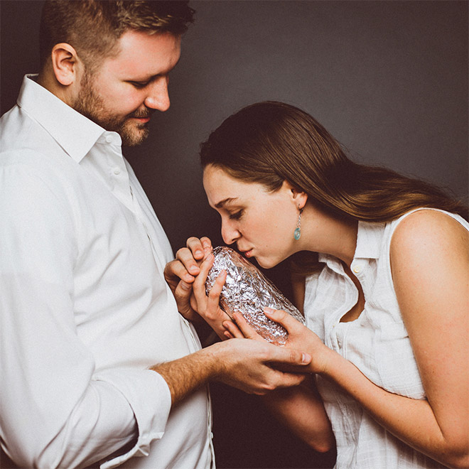 Happy young baby burrito parents.