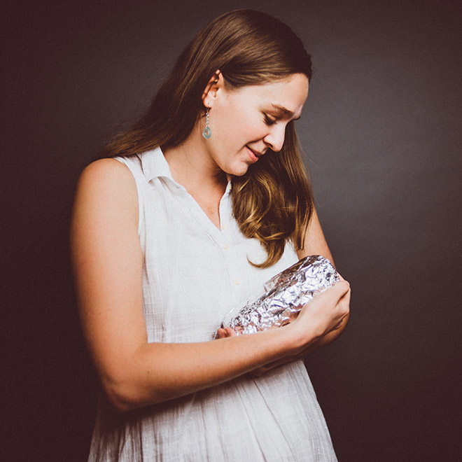 Happy young baby burrito parents.