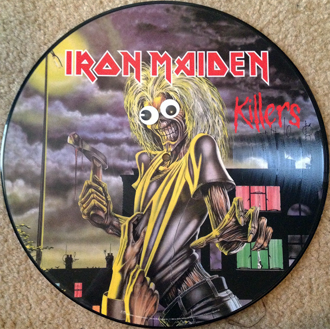 Heavy metal album with googly eyes.