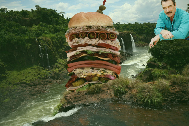 Tom Selleck hanging out with a sandwich in a waterfall.