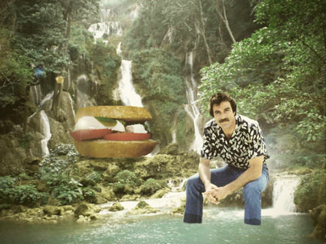 Tom Selleck hanging out with a sandwich in a waterfall.