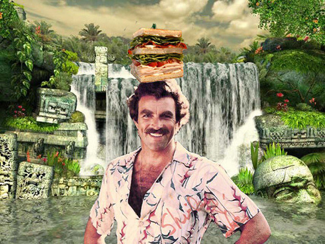 Tom Selleck hanging out with a sandwich in a waterfall.