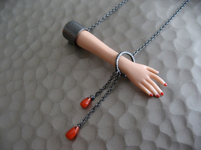 Jewelry made from chopped up Barbie parts.