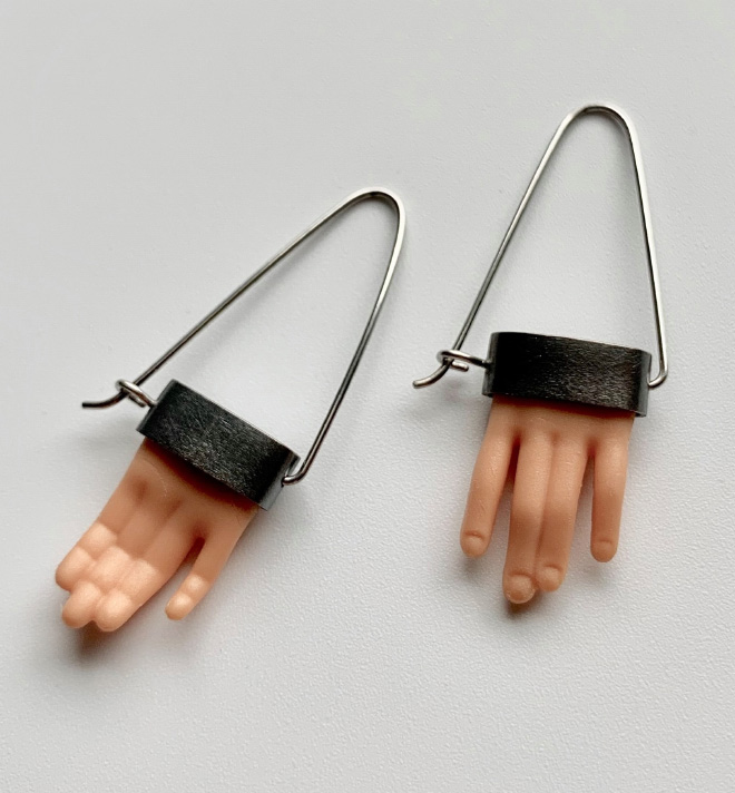 Jewelry made from chopped up Barbie parts.