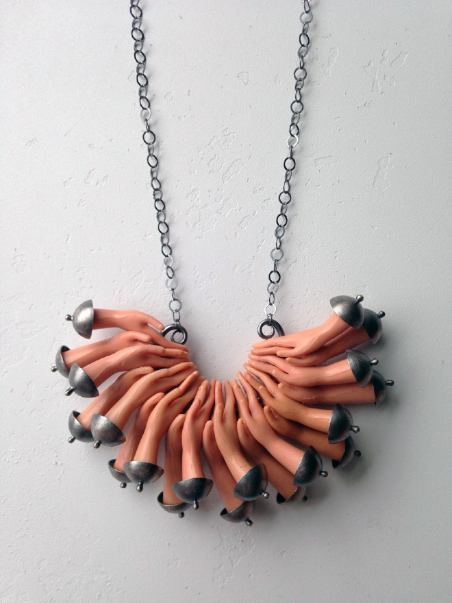 Jewelry made from chopped up Barbie parts.