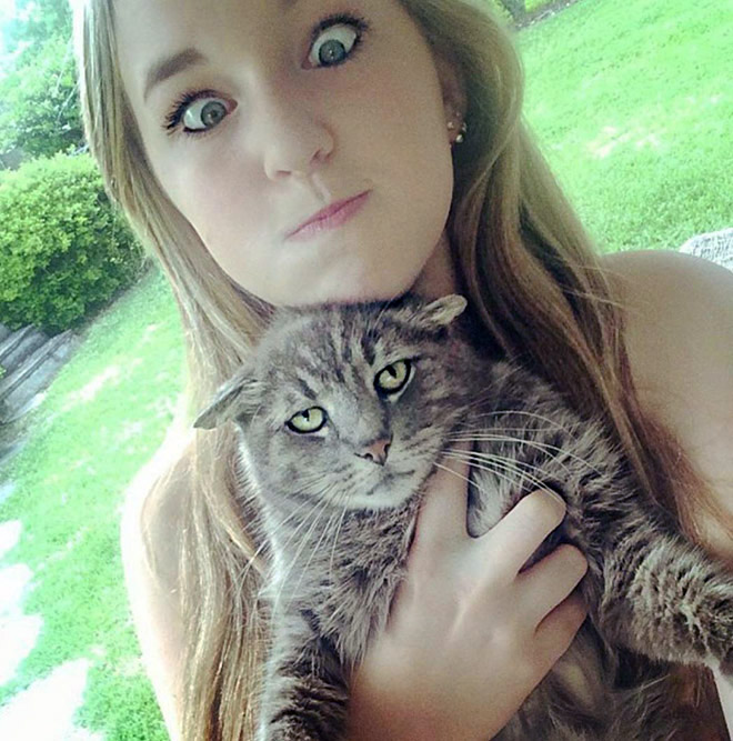 Not all cats like participating in selfies.